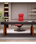 Top Shelf Electric Height Adjustable Standing Desk Featuring Deep Storage Drawers And Snazzy USB Charging Hub Heavy Duty Gaming Rig For A Sleek Home Office Flex Measuring 180 Cm Across For Max Comfort in modern office with red chair.