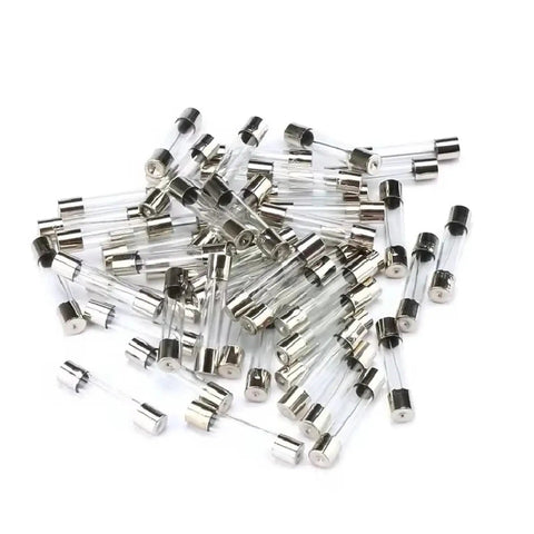 Assorted Glass Tube Fuses Kit 5x20mm And 6x30mm Fast Blow Range 0.1A To 30A scattered on white background