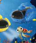 Blue 4 Channel RC Mini Submarine With Dual Propellers For Pool Play Featuring LED light beside yellow submarine underwater.