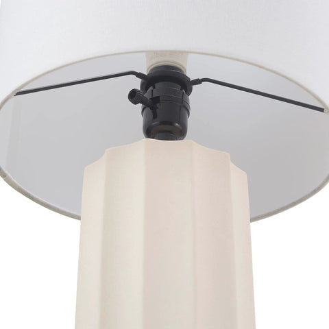 Close-up of the ribbed concrete base of a 20 Inch Rustic Table Lamp With Ribbed Concrete Base And White Linen Shade, Cottagecore Accent Light For Living Room, Bedroom Or Office, Modern Yet Glamorous Home Decor.