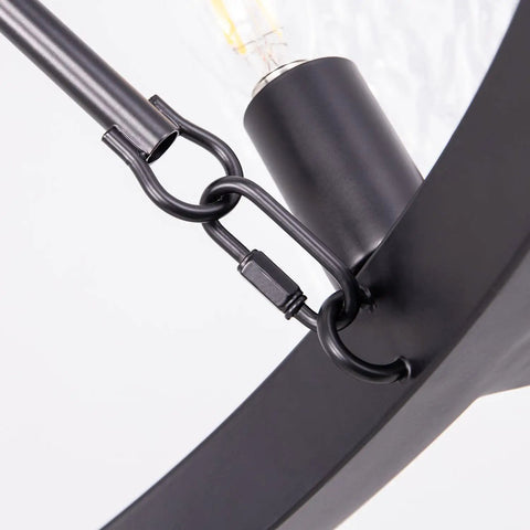 Close-up of 5 Light Black Farmhouse Chandelier for Dining Room and Foyer, Go-To Rustic Round Wagon Wheel Pendant detail with chain link
