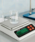 Industrial Counting Scale for Parts and Coins With 10 Kg Capacity featuring LED display, shown with beaker on stainless steel pan.