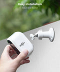 Installing a solar powered wireless outdoor security camera from the kit with adjustable bracket, IP66 weatherproof design.
