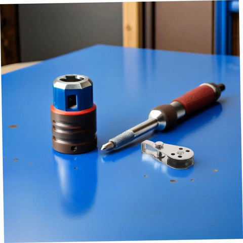 Stainless Steel Sailing Pulley Block Set Four Pack With Bearing Wheels next to screwdriver and clamp on blue table surface.