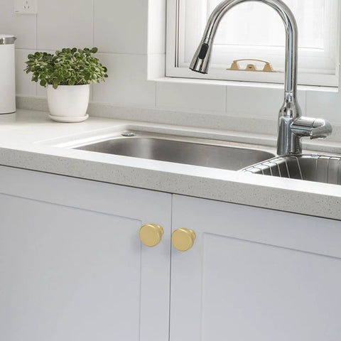 10 Pack Brushed Brass Kitchen Cabinet Knobs With Knurled Texture installed on white kitchen cabinet doors