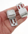 Heavy Duty Steel Sofa Spring Clips And Sectional Connectors 50 Pack Couch Repair Kit showing steel clips in hand for secure spring fixing.