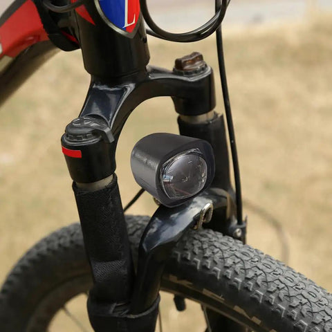 Rock Your Ride With This Super Cool 2 In 1 Waterproof E Bike LED Headlight That Doubles As A Loud Horn For Safety On Any Scooter Motorcycle Or Bicycle Out There black LED headlight on bicycle fork