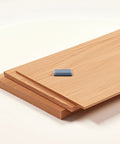 12 Piece PTFE Furniture Glides on wood floor panel