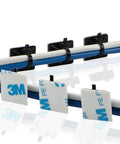 Three Quarters Inch Black Cable Zip Tie Mounts With Adhesive Backing, securing blue and white cables in an organized line