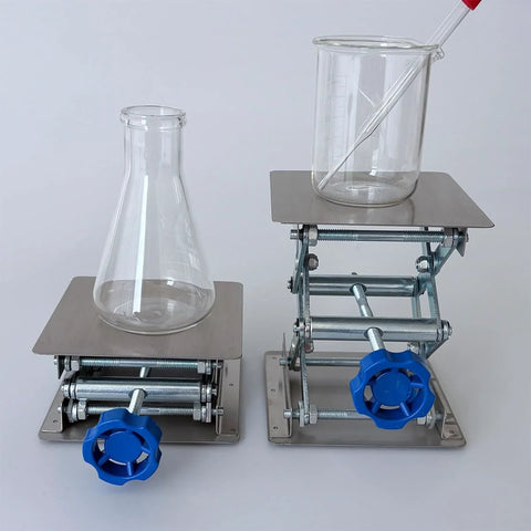 Front view of two stainless steel lab jack stands with table lift, 4x4 top plates, blue knobs; beakers on platforms
