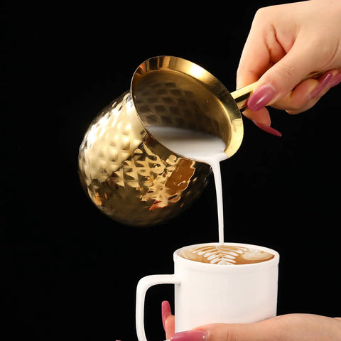Gold Hammered Stainless Steel Turkish Coffee Cezve 7 Oz 200 Ml Ibrik With Heat Resistant Handle pouring milk into coffee cup