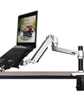 Heavy Duty Aluminum Spring Arm Desk Mount Supports 17 To 27 Inch Screens With A Dang Sturdy Clamp Super Smooth Tilting Action For Zero Sweat Ergonomic Office Setup, holding laptop on desk.