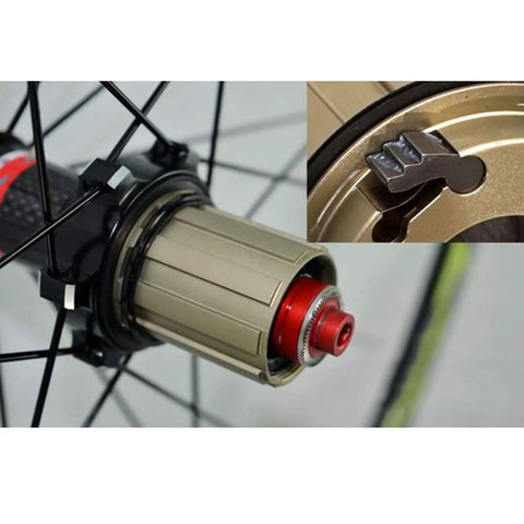 Close-up of the hub and cassette area of a 700C Road Wheelset With 30mm Aluminum Double Wall Rims, showcasing quick release mechanism.