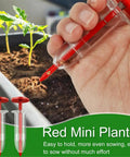 Hand using Upgraded Mini Seed Dispenser Set Handheld Manual Syringe Seeder Sower Spreader for precise planting in garden