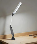 Heavy Duty 110V 16W LED Machine Work Light featuring adjustable bracket on a workbench, ideal for CNC, lathes, and drill tasks.