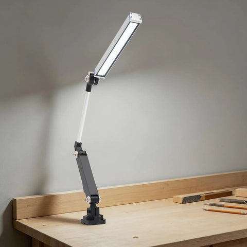 Heavy Duty 110V 16W LED Machine Work Light featuring adjustable bracket on a workbench, ideal for CNC, lathes, and drill tasks.