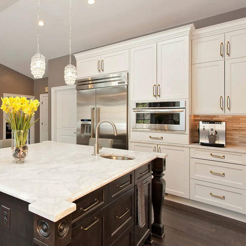 Modern kitchen with white cabinets featuring Six Pack 5 Inch Antique Brass Cabinet Handles With Linear Coin Edge Texture for renovation.