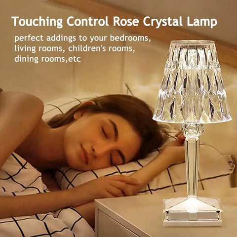 Rose Crystal Touch Table Lamp With 2000mAh Rechargeable Battery next to sleeping woman, diamond shaped LED light on nightstand.