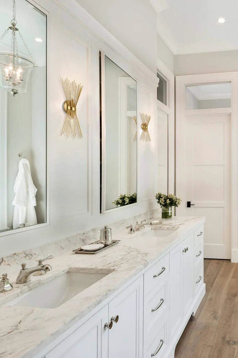 Bathroom with 2 Light Starburst Wall Sconce In Black Finish, mid-century modern vibe lighting, above white marble vanity.