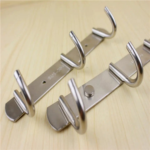 Heavy Duty Stainless Steel Wall Mount Hooks Low Profile Hidden Storage Setup Hella Durable Rust Resistant Key And Coat Rack Three Pack showing close-up of hooks.