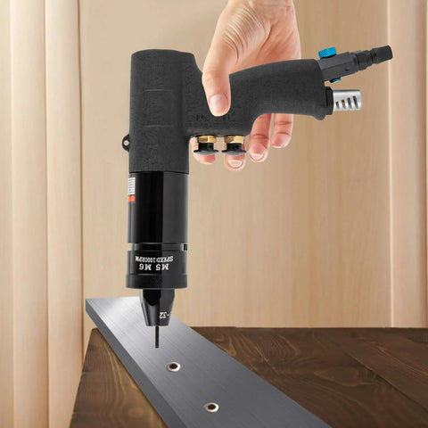 Person using Air Powered Rivet Nut Gun Kit With Quick Change Nose Pieces Pneumatic Rivet Nut Pull Setter on metal