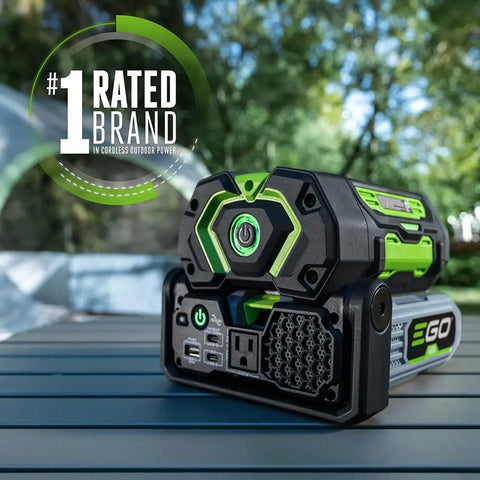 Hella Reliable Portable Pure Sine Wave Power Inverter Pumping 400w Continuous And 800w Peak Watts With Trio Of Quick Charge Ports close-up angle on a portable power inverter outdoors.