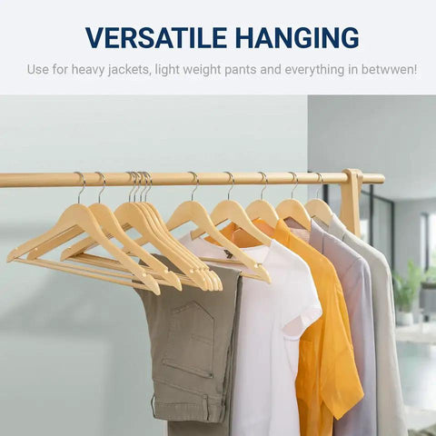 Straight Up Premium Quality Natural Wooden Coat Hangers Thirty Pack flat profile wood suit hangers with clothes displayed on a rack.