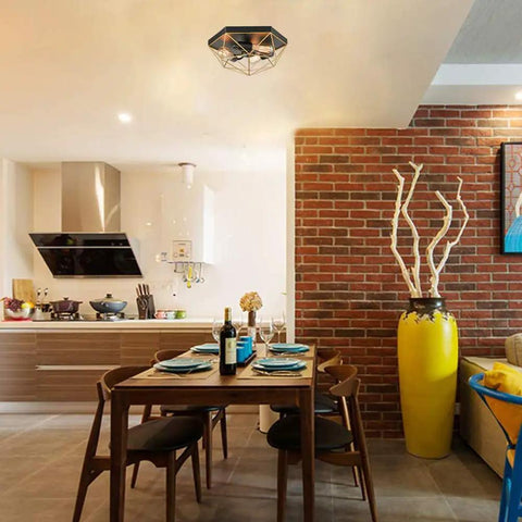 Brass Industrial Flush Mount Ceiling Light 3 Light Square Cage Fixture in Black and Gold installed in a modern kitchen dining area.