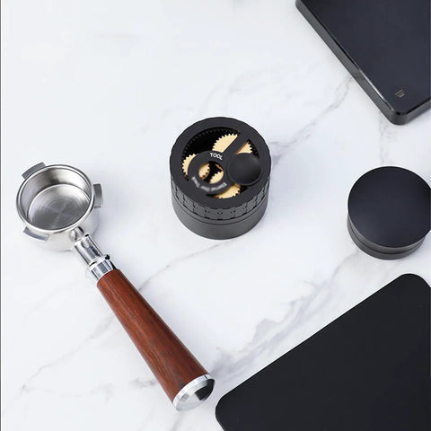 Geared Espresso Leveler And Magnetic Coffee Needle Distributor For 51 54 58 Millimeter Portafilters with wooden handle and black base.