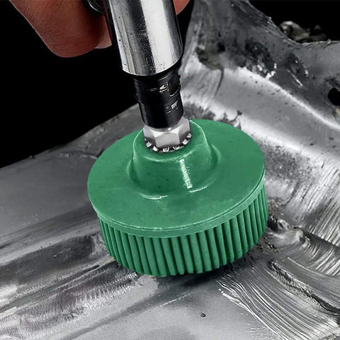 Close-up of green 2 inch bristle disc in use on metal surface, part of Six Pack Two Inch Bristle Disc Set With One Quarter Inch Shank Grit 50 80 120 For Metal Deburring Blending Finishing And Abrasive Coating Removal On Steel Aluminum And Hard Metals