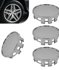 Set Of Four Sleek Silver Wheel Hub Center Caps With A Dead Snap Fit That Shuts Out Rain And Road Grit To Beat Rust On Those Exposed Bolts While Keeping Your Rim Setup Looking Fresh All Season Long on a vehicle.