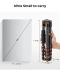 Person holding 60 Inch Carbon Fiber Tripod For Cameras Ultralight Travel Buddy next to laptop for size comparison