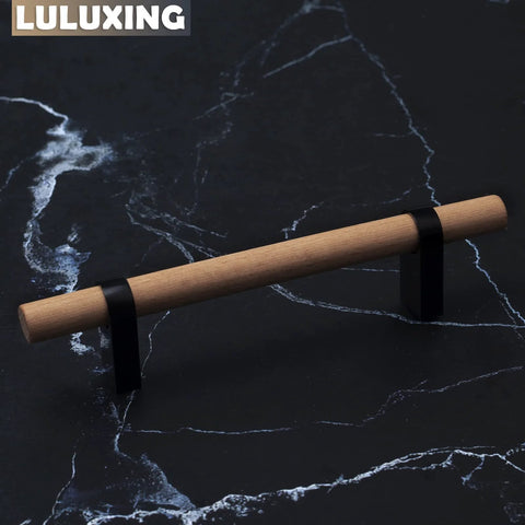 Six Pack Solid Wood Cabinet Handles And Pulls 4.4 Inch Center T Bar on dark marble surface