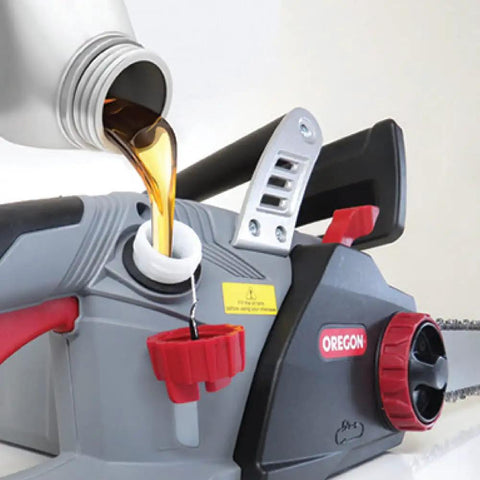 All Season Chainsaw Bar And Chain Oil Lubricant For Gas And Electric Saws The Go To Premium Formula With Extra Tacky 32 Oz being poured