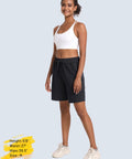 Model wearing Women's Hiking Shorts With 8 Inch Inseam, Lightweight Quick Dry Fabric, Built In Pockets, Ideal For Running And Golf, Black