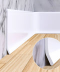 Flexible Baseboard Molding Trim 4 Inch Wide 20 Feet Long Peel And Stick Self Adhesive Vinyl Wall Base Cove Base Rubber Construction displayed on hardwood floor and marble wall.