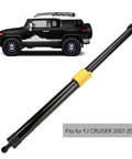 Tough As Nails Rear Door Stay Support Shock For FJ Cruiser 2007 To 2014 shown with vehicle, heavy-duty gas strut with yellow cap.