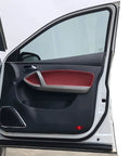 Automotive door weather strip seal; black rubber, self-adhesive, side view of an open white car door with red interior panel