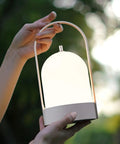 Person holding All Day 4000mAh Rechargeable LED Lantern Table Lamp With Cordless Power 4 Level Touch Dimming Handy Outdoor Night Light
