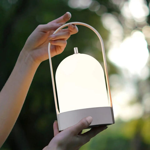 Person holding All Day 4000mAh Rechargeable LED Lantern Table Lamp With Cordless Power 4 Level Touch Dimming Handy Outdoor Night Light