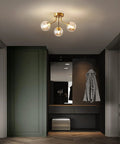 Three Light Sputnik Chandelier In Bold Gold Finish Semi Flush Mount Ceiling Light Fixture With Glass Globe in hallway