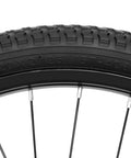 Close-up of 20 inch kids bike front wheel replacement with solid air rubber tire and inner tube, showing tread and rim detail
