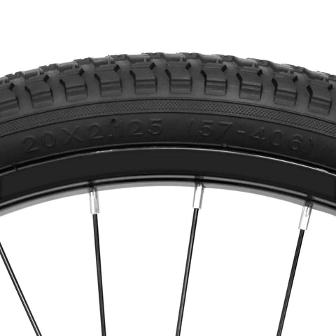 Close-up of 20 inch kids bike front wheel replacement with solid air rubber tire and inner tube, showing tread and rim detail