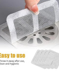 Disposable Shower Drain Covers That Are Absolute Lifesavers For Stopping Hair Clogs Cold Easy Peel Mesh Screens For Bathtubs And Floor Drains 10 Pack being applied over a drain.