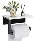 Modern Matte Black Toilet Paper Holder With Shelf, 7x4x2.4in, metal with marble top, featuring tissue dispenser and decor items.