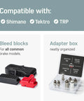 Bleed blocks and adapter box from Pro Grade Brake Bleed Kit For Shimano Tektro And TRP Hydraulic Disc Brakes With Video Guide Includes 2x Mineral Oil Fluid Do It Yourself Bleed Tool For Road And Mountain Bikes, showing compatibility with Shimano, Tektro, and TRP.