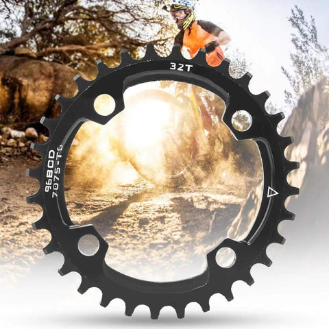 96BCD Narrow Wide Mountain Chainring 32T Round Replacement for MTB, black alloy, shown with mountain biking background