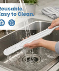 Person cleaning Paint Behind Toilet Tool Kit With 12-Inch Reach Flat Brush under running water in kitchen sink