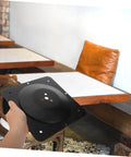 Heavy Duty Cast Iron Coffee Table Leg Connector Plate With Rock Solid Mounting Screws Built Tough DIY furniture bracket in hand.