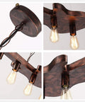 Close-up of Dope Bronze Linear Island Light With Guitar Shade, showing detailed fixture and bulbs, industrial farmhouse style.